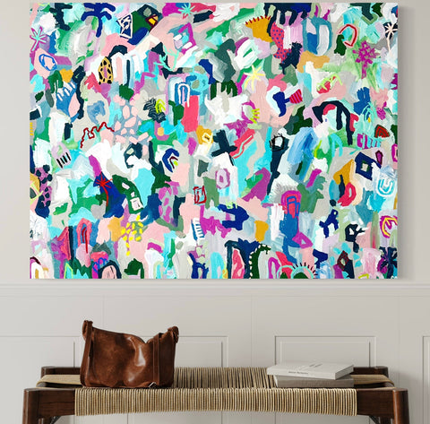 large colorful acrylic painting on canvas hangs on wall in entry way with leather purse. minimalist decor and design style in home