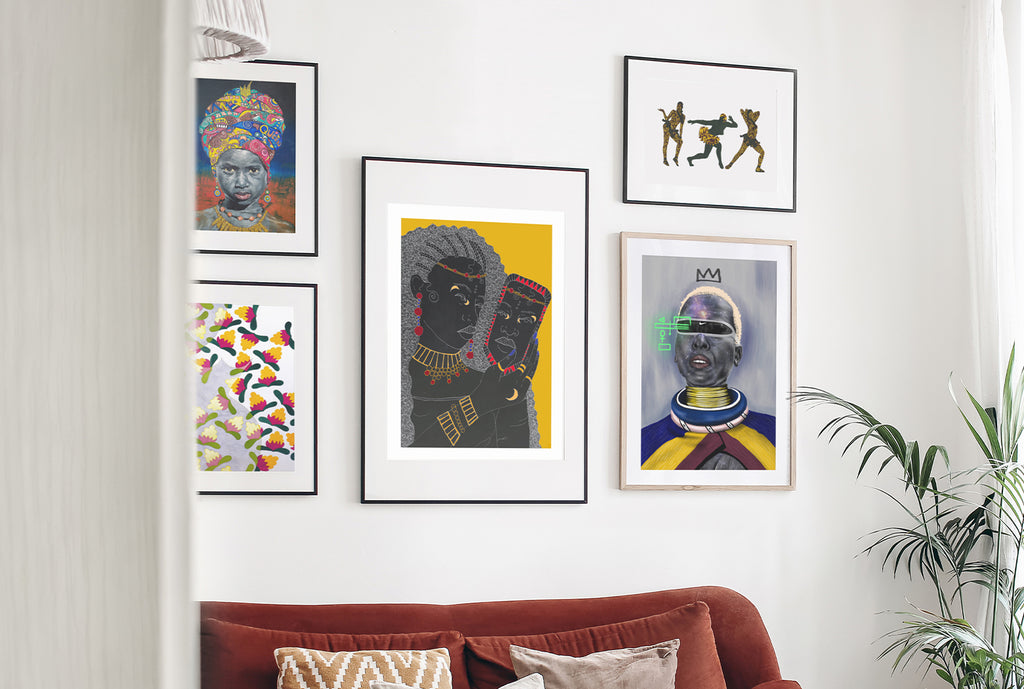 Framed artist prints on a wall at home