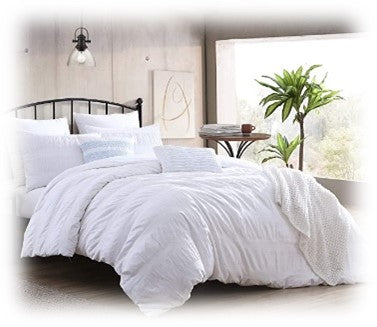 white luxurious beddings, plush throw blankets and pillows
