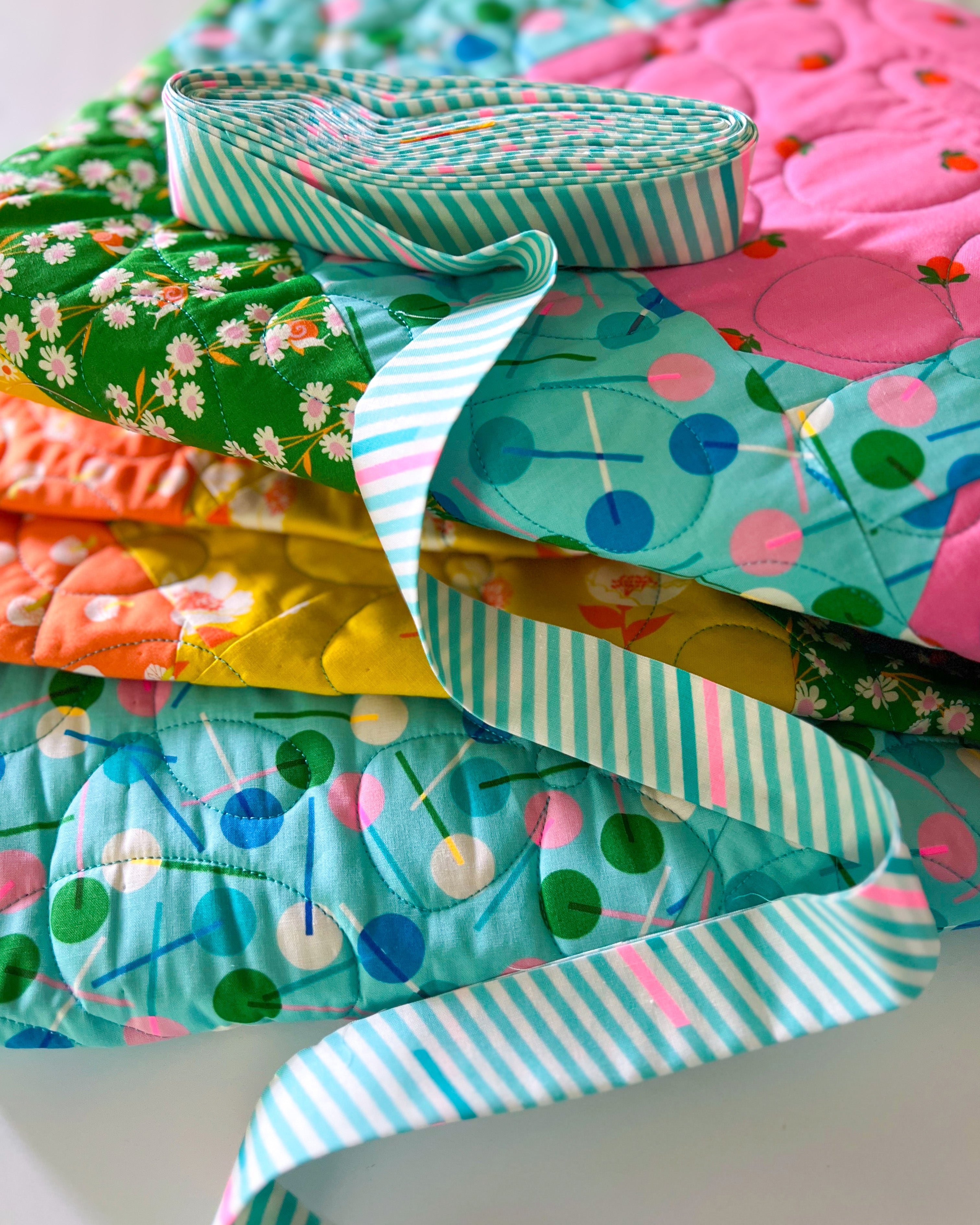 Smashing Petal Quilt with binding tape laid on top