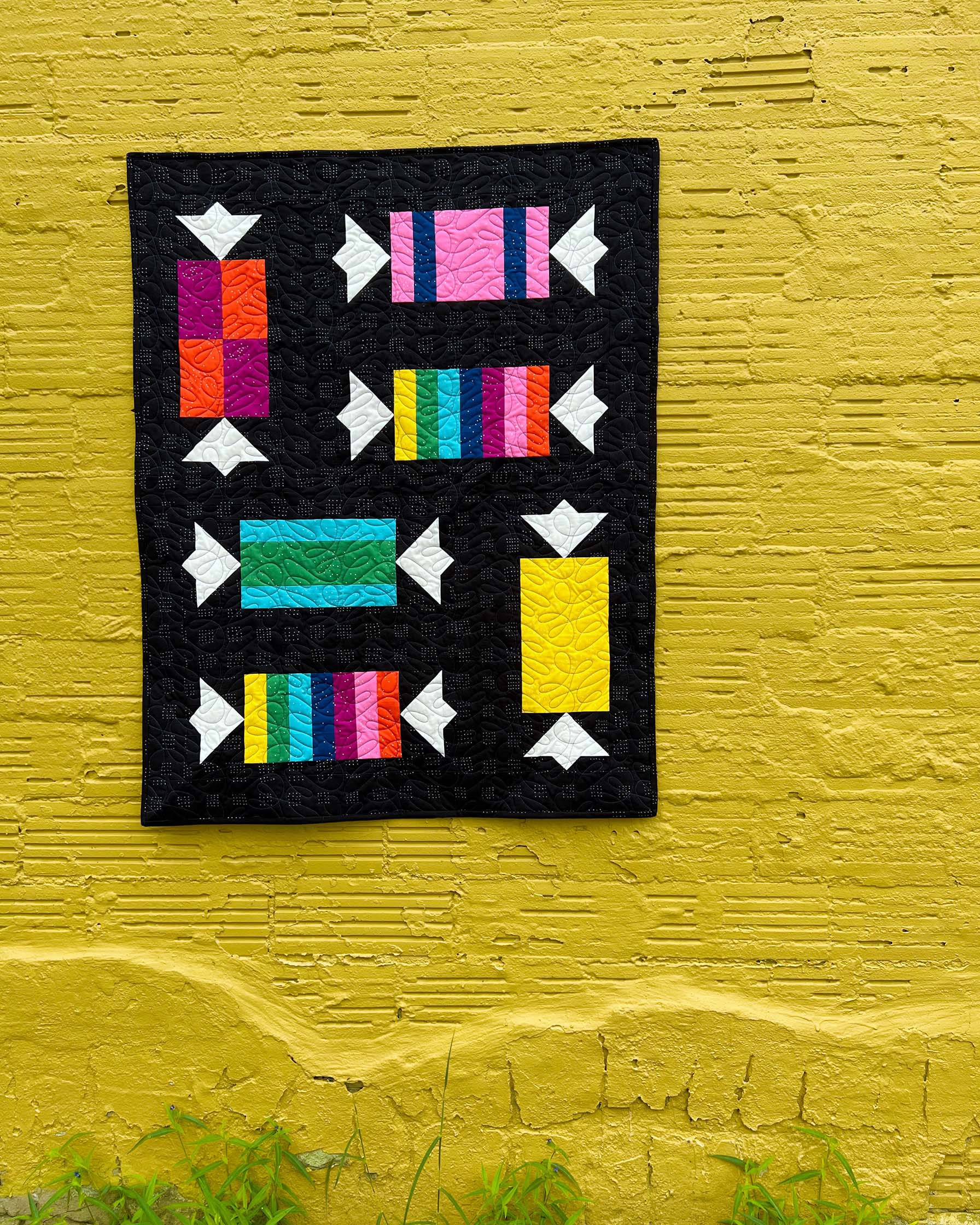 Yum Yum Candy Quilt on yellow wall