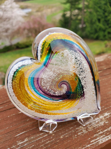 Glass heart, swirled with amber, aqua, and blue.