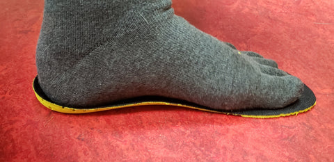 Standing on the insole with heel in the heel cup