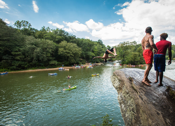 river party with cliff jumping
