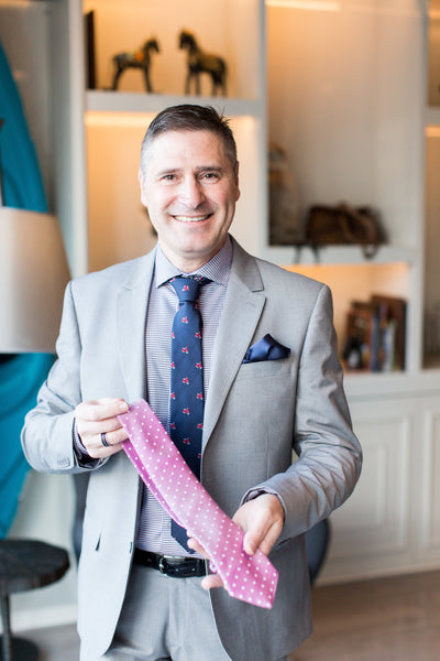 Pasquale Iovinella holding one of his handcrafted neckties