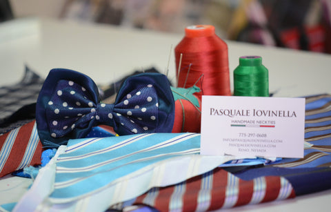 Pasquale Iovinella handcrafted bowtie, spools of thread and a business card