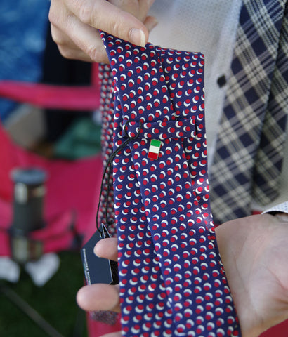 Necktie with flag pendant
