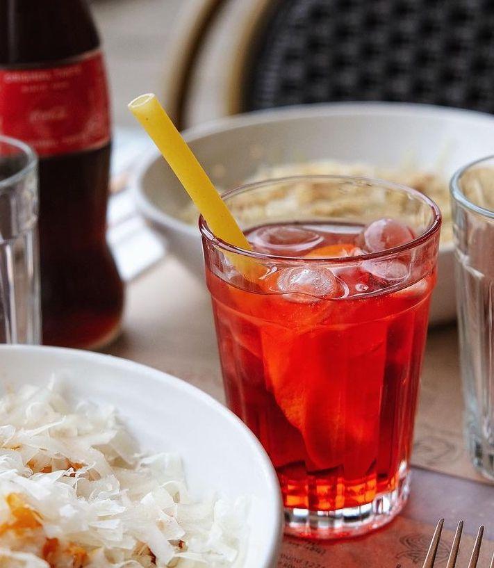 Image of a Negroni with a stroodle pasta straw