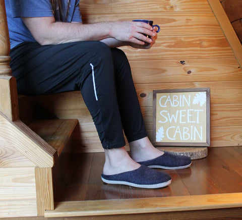 Astoria slippers on wood stairs