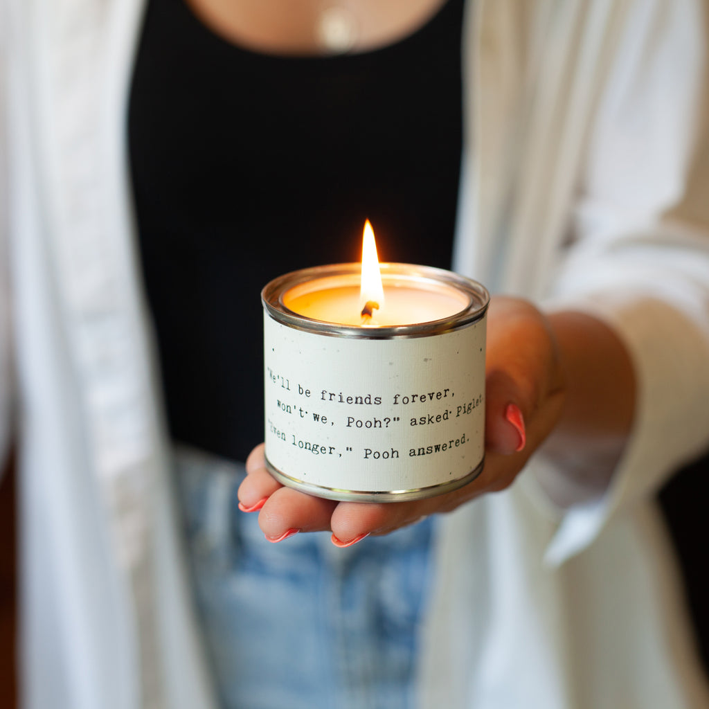 A girl holding a lit candle