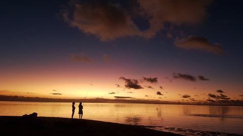 Beautiful Sunset with a couple in silhouette at Bain Boeuf Beach, Mauritius