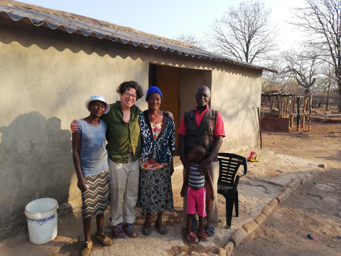 Oy-Ling standing in between Sophie, Ishumael and family after spending the weekend camping at their home in Chiredzi, Zimbabwe