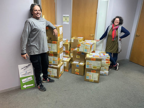 Adriaan and Oy-Ling posing with their Friday crystal and mineral shipments from South Africa. ZA minerals now ships globally from Mauritius.