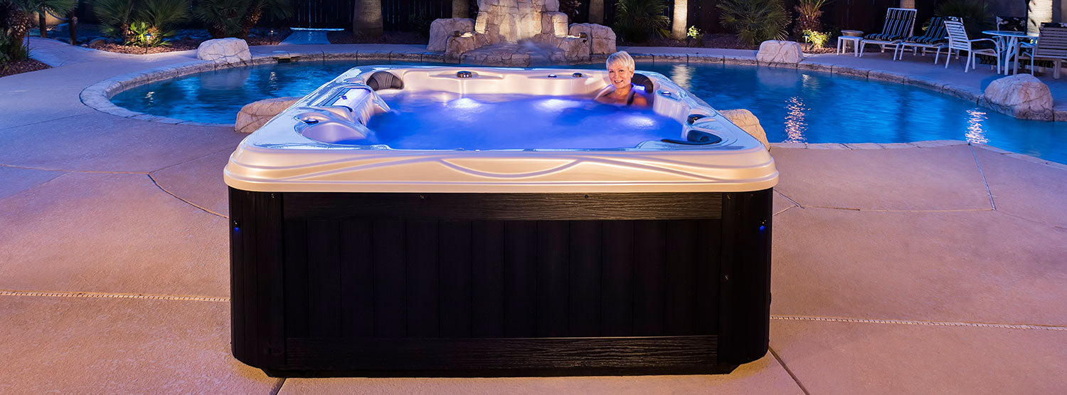 Woman Relaxing In an Island Antigua Elite Spa & Hot Tub by Artesian Spas