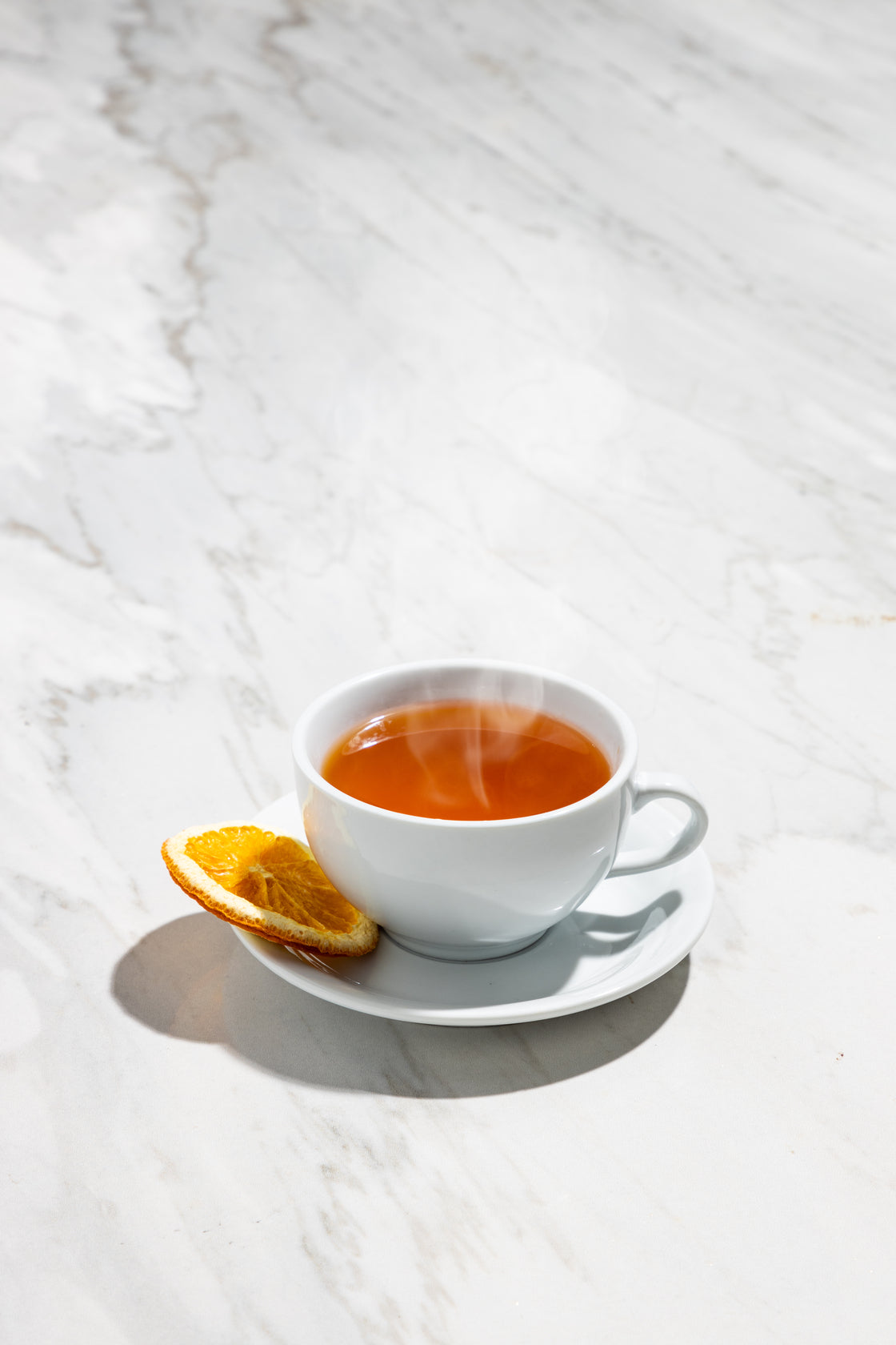 Whisky Hot Toddy from Starward in a tea cup on a marble surface