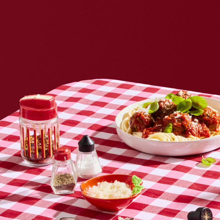 Italian food at a table with red and white table cloth from Starward whisky