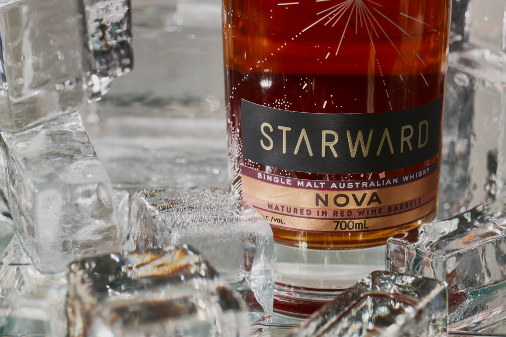 Starward Nova surrounded by Ice to show off the light colour of  the whisky