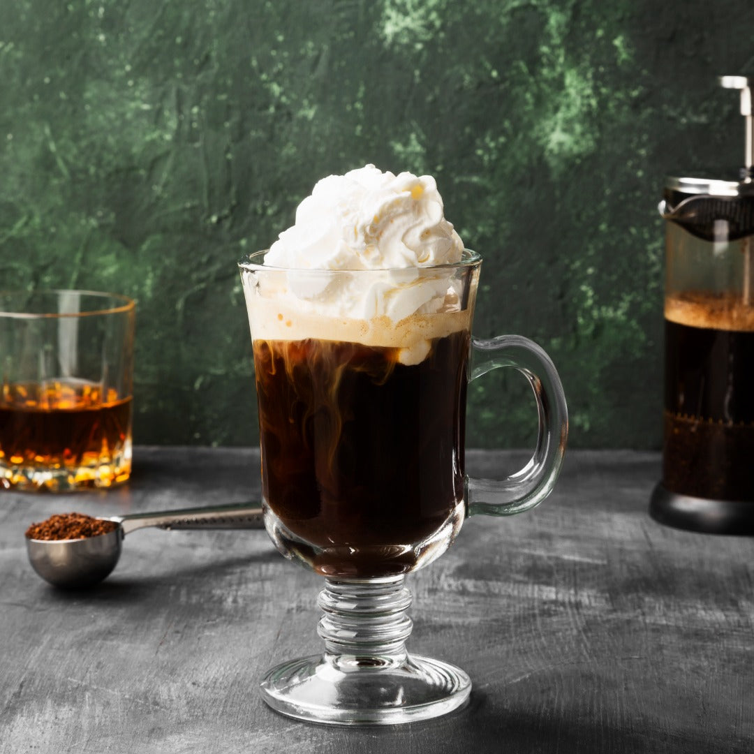 A delicious looking coffee cream cocktail in a tall glass with a handle from Starward