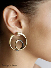 Circular brass earrings designed by Art Smith