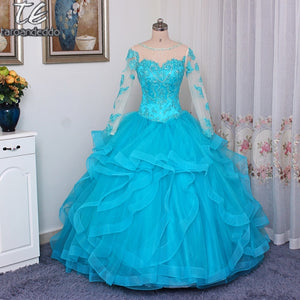 Sweetheart Neckline On Peacock Bright Colors For This Quinceanera Gown.