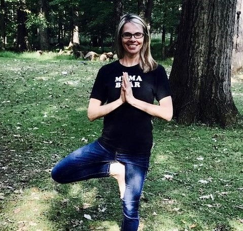 Woman with dysautonomia doing a yoga pose 