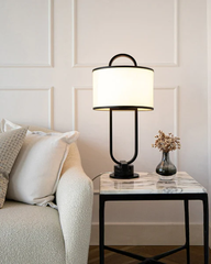 Decorative table lamp with a black metallic frame