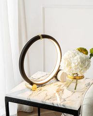 Futuristic black and gold circular table lamp