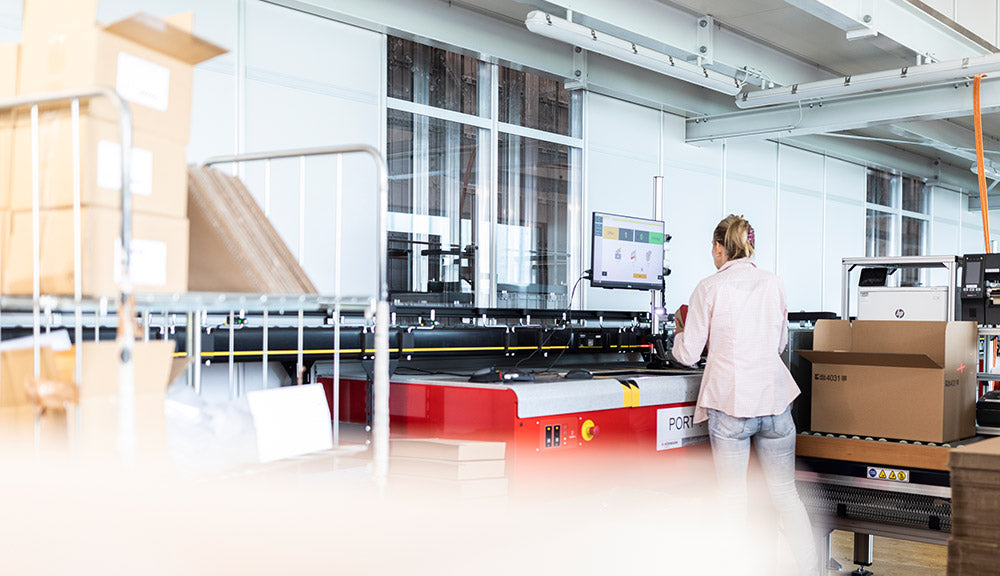 employe working at the automatic warehouse system