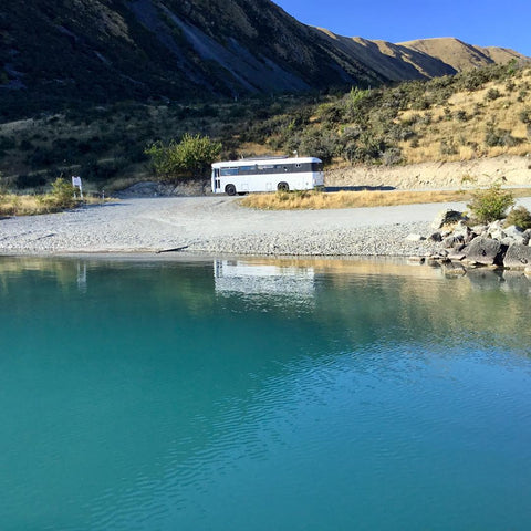 Solar housebus by a lake in New Zealand