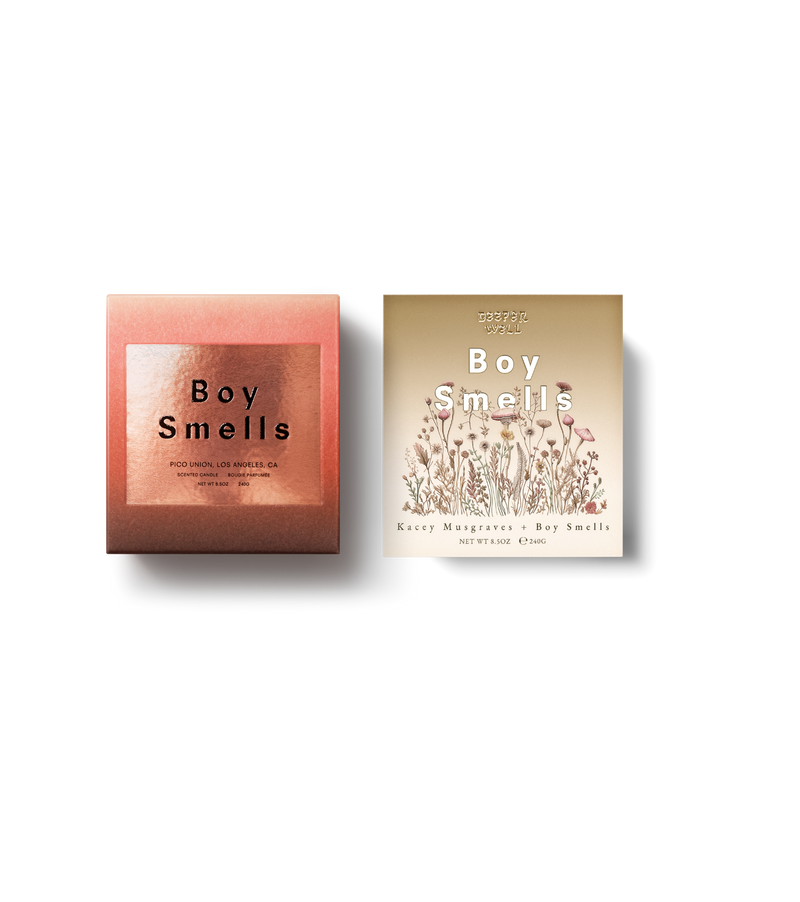 Product shoot of Kacey Musgraves x Boy Smells , Slow Burn + Deeper Well candle box. Deeper Well with tan ombre matte box and gold Deeper Well text with white Boy Smells text below. Also featuring a mushroom and herbal drawing motif. Slow burn has red ombre finish with embossed text and metallic gold label. 