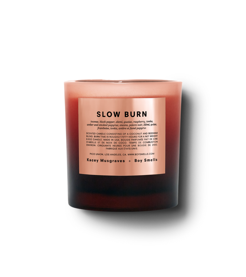 Product shot of Slow burn in a blood red ombre vessel with a peach label and black text against a neutral background.