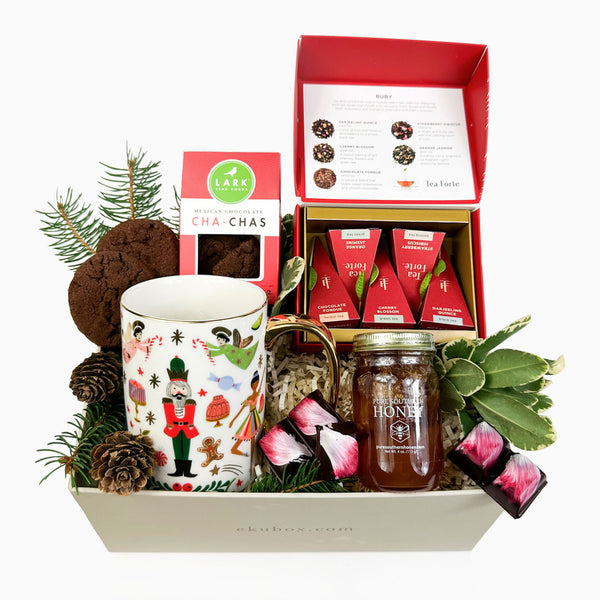 Holiday Gift Box Nutcracker Sweet gift box by ekuBOX. Rifle Nutcracker mug, tea forté teas, wildflower honey, strawberry balsamic artisan chocolate and more!