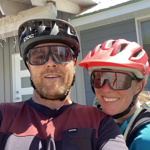 Two happy riders wearing biking glasses