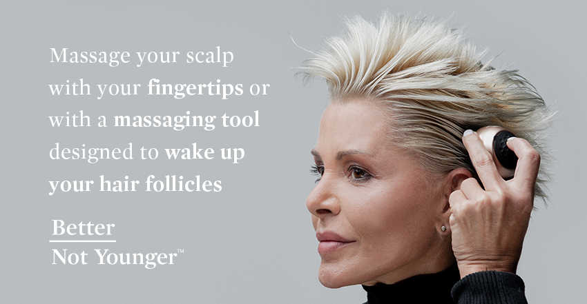 A blonde woman with short hair s massaging her scalp with a massaging tool designed to wake up hair follicles and promote hair growth