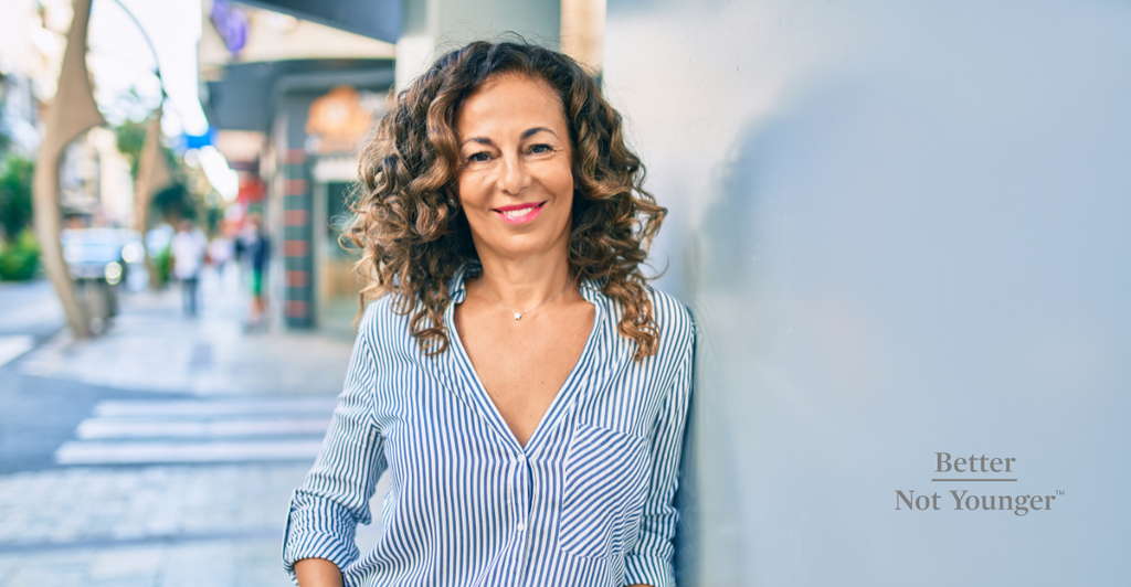 A woman with long layers on her curly hair. Easy hairstyles for curly hair.