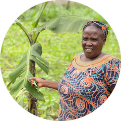 Kenya Artisan Standing next to Banana Tree