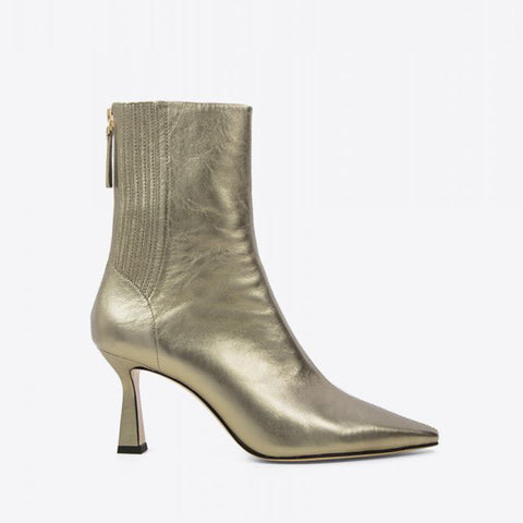 Gold metallic ankle heeled boots by Lola Cruz