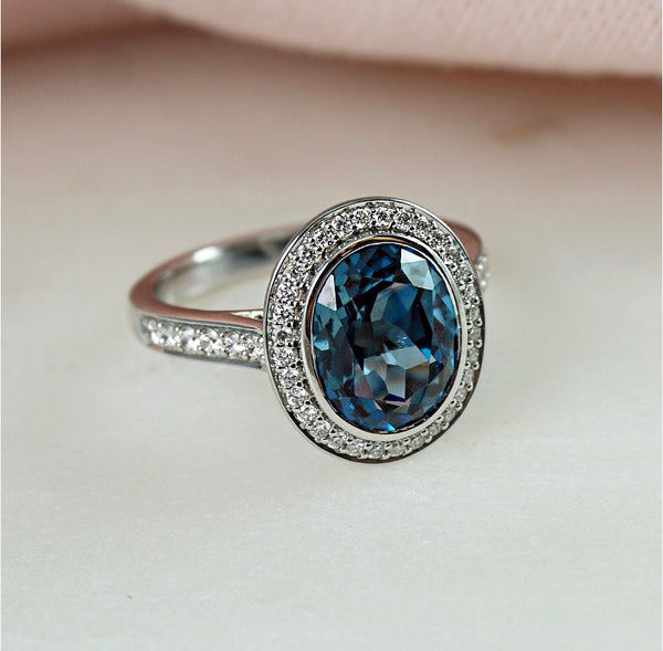 Blue Topaz & Diamond Bezel Set Halo Ring