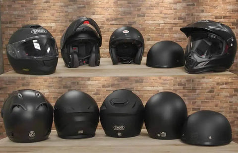 various motorcycle helmets displayed