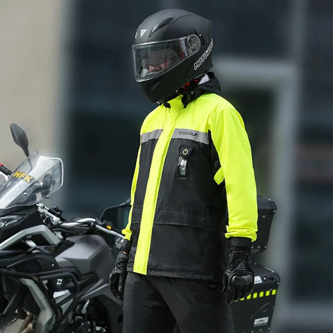 hi visible rain gear with a man standing in front of a motorcycle