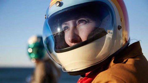 woman wearing a motorcycle helmet