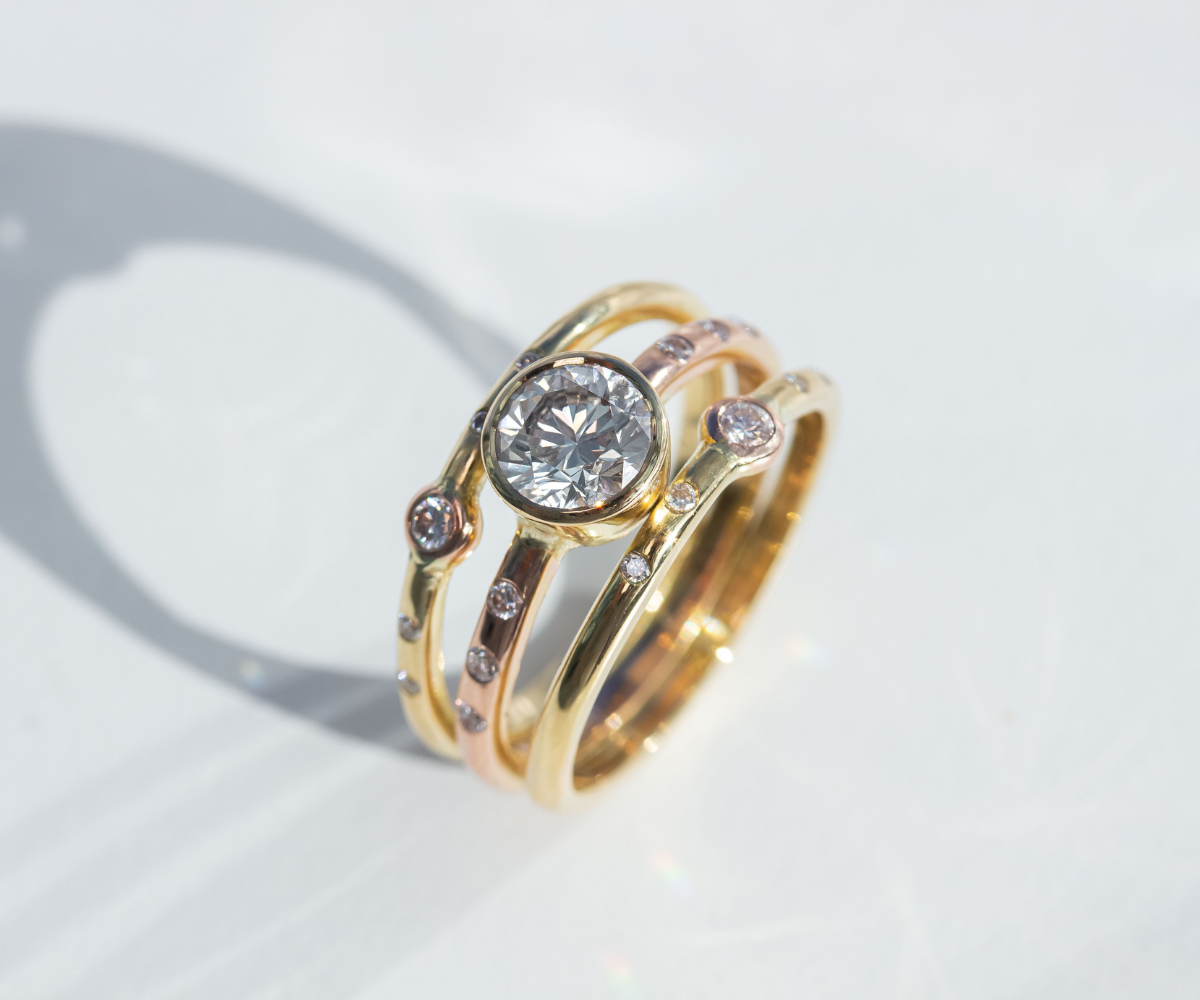 triple band diamond ring remodel with mixed yellow and rose gold metal