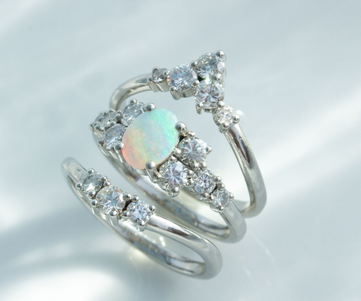 triple diamond and opal bridal ring set in 18K white gold