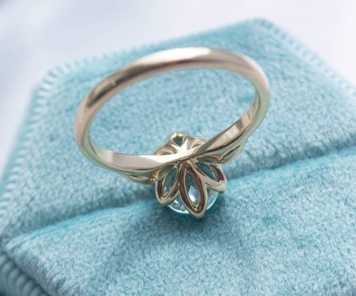 Aquamarine leaf inspired bridal ring set in 9k yellow gold