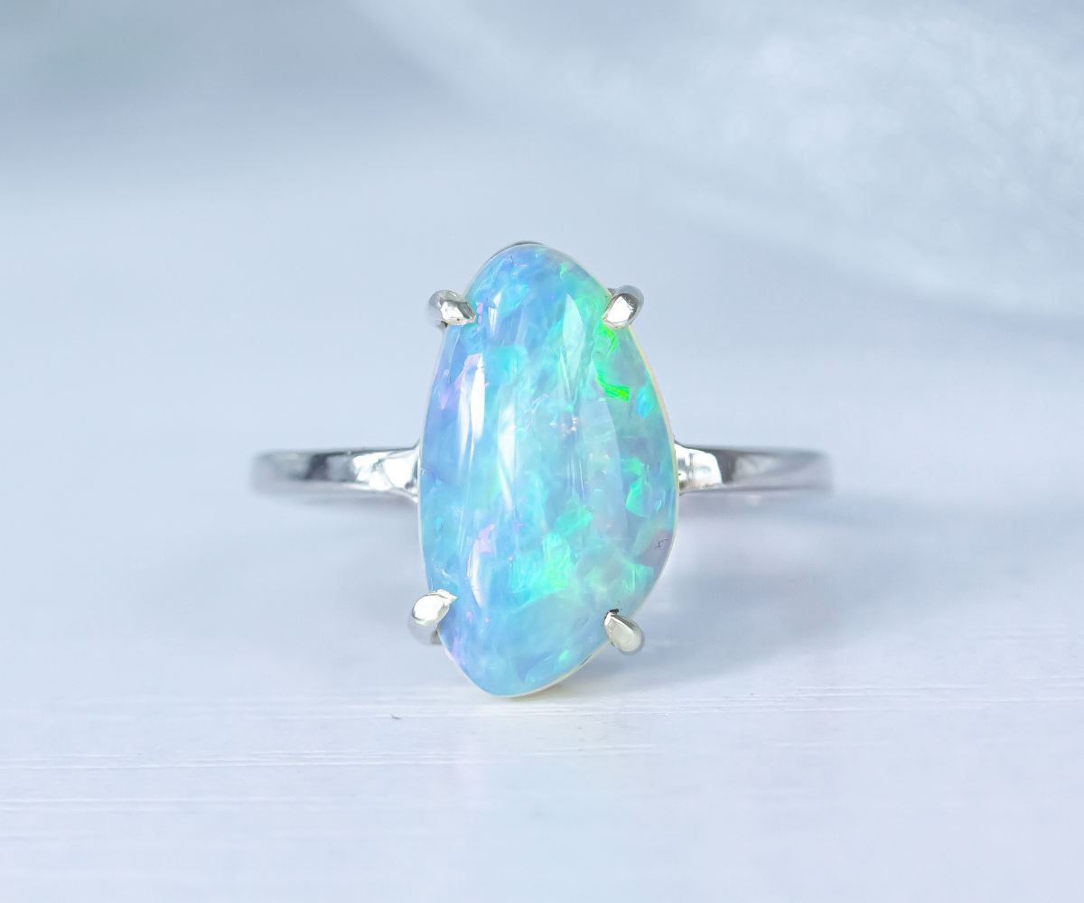 crystal opal claw set ring in white gold