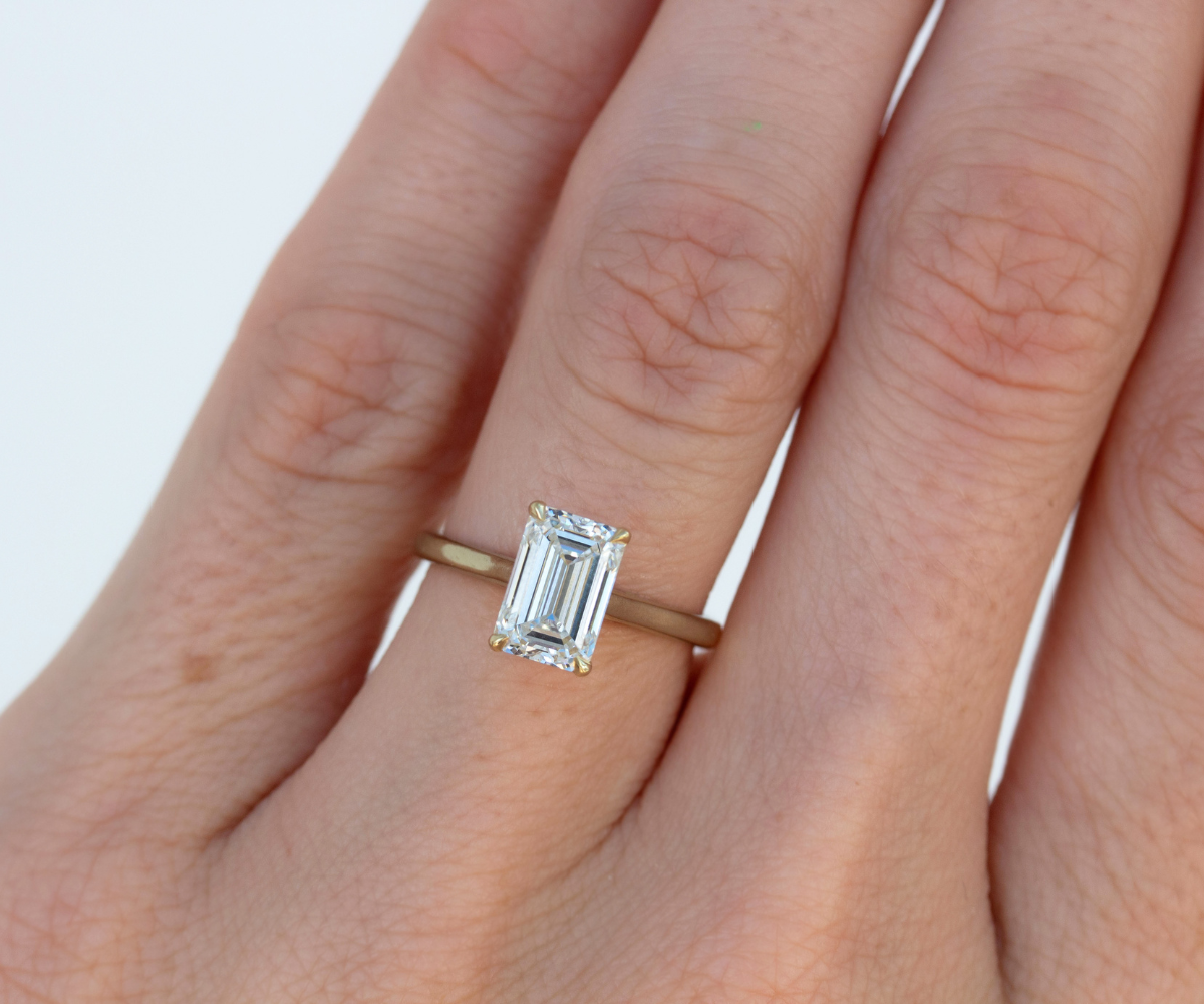 Emerald Cut Solitiare Diamond ring in 18K Yellow gold