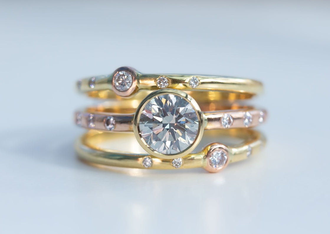 Triple Ring Design in 18K Yellow and Rose Gold and 1ct Diamond Ring Remodel on white background