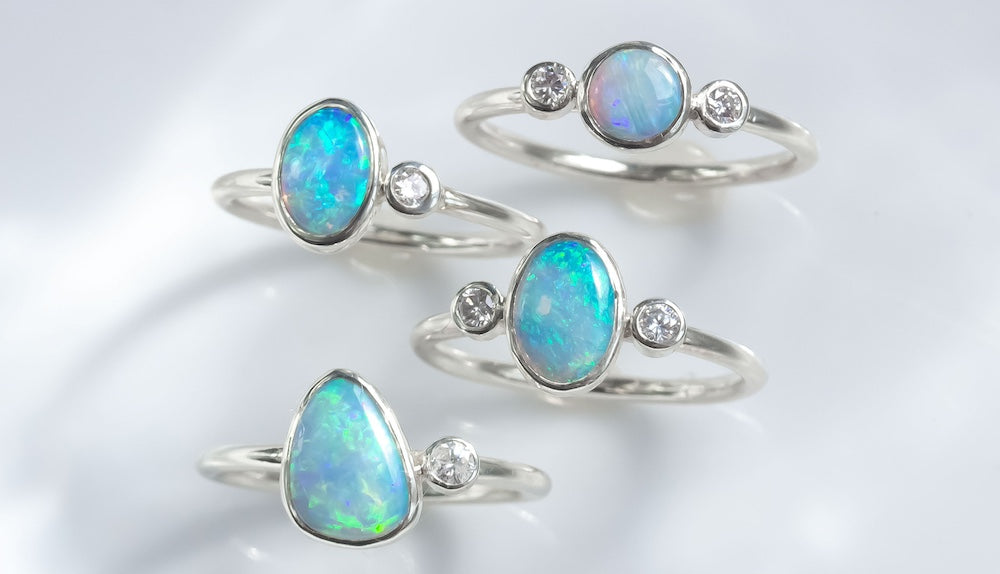 Crystal Opal Island engagement rings with diamond in white gold