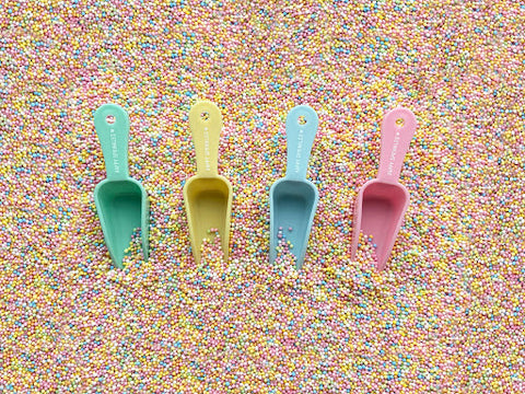 Sprinkle scoops in pastel colors for sprinkle mixes and cake decorations