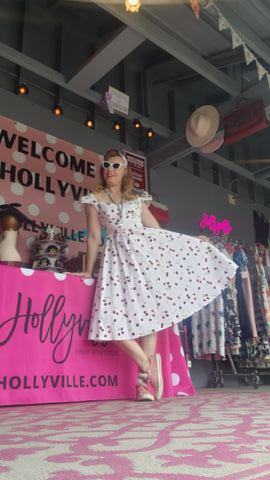 Pinup model and Hollyville owner, Pamela Marie wearing a classic retro cherry print swing dress while vending at the WI State Fair.